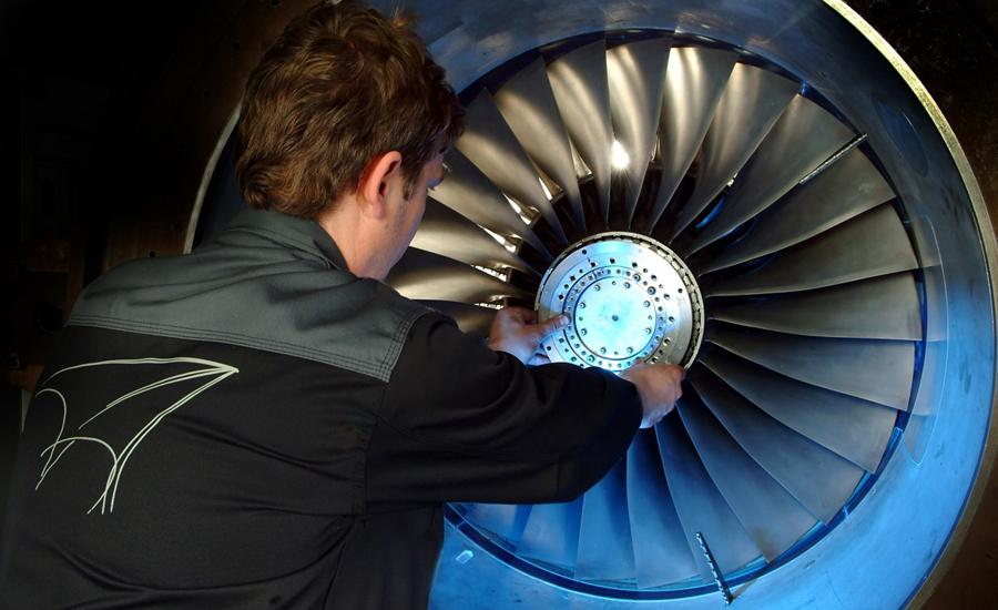 Man works on turbine at AneCom AeroTest